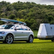 The new trailer has a compact design that unfolds to 700 cubic feet of space. It has a solar grid that also powers a hot shower.