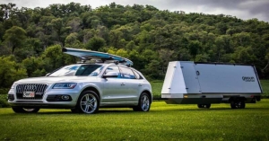 The new trailer has a compact design that unfolds to 700 cubic feet of space. It has a solar grid that also powers a hot shower.