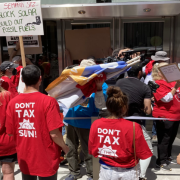 Solar industry supporters rallied outside of Sempra’s San Diego headquarters complaining about making rooftop solar much more expensive.