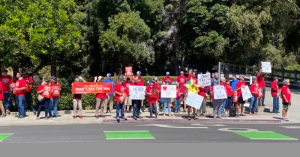 Solar workers, consumers, clean energy advocates, community leaders, conservationists, and climate activists protest at PG&E office