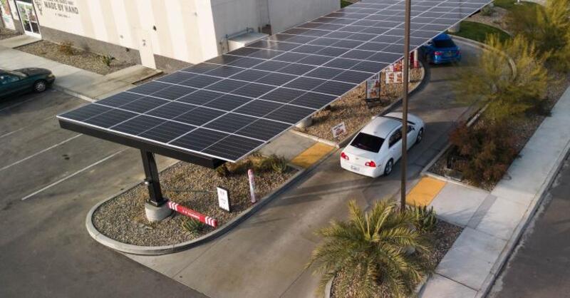 KFC installs a solar-powered drive-thru in Bakersfield, CA to protect workers from the sun, and to save the unit $400,000 over its lifespan.