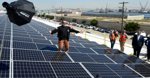 Former Gov. Arnold Schwarzenegger and a crowd of more than 100 people celebrated a completed solar rooftop project at AltaSea.