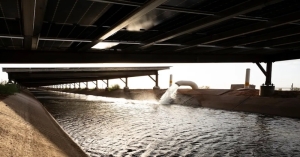 Work is nearly complete on a pilot project erecting solar canopies over a canal on tribal land south of Phoenix.