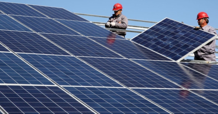 Workers install solar panels at a residential home in a village in Dongying Solar power units will be installed at 130 primary healthcare facilities in Ukraine, allowing them to significantly reduce electricity costs.